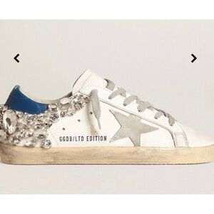 Super-Star with a white leather upper feature a star in ice-gray suede